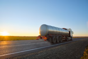 petrol cargo truck driving on highway hauling oil
